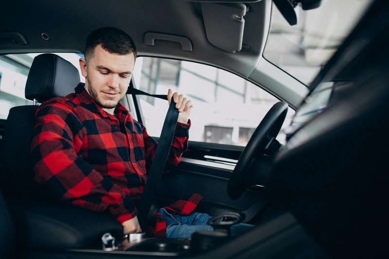 A person adjusting its seat